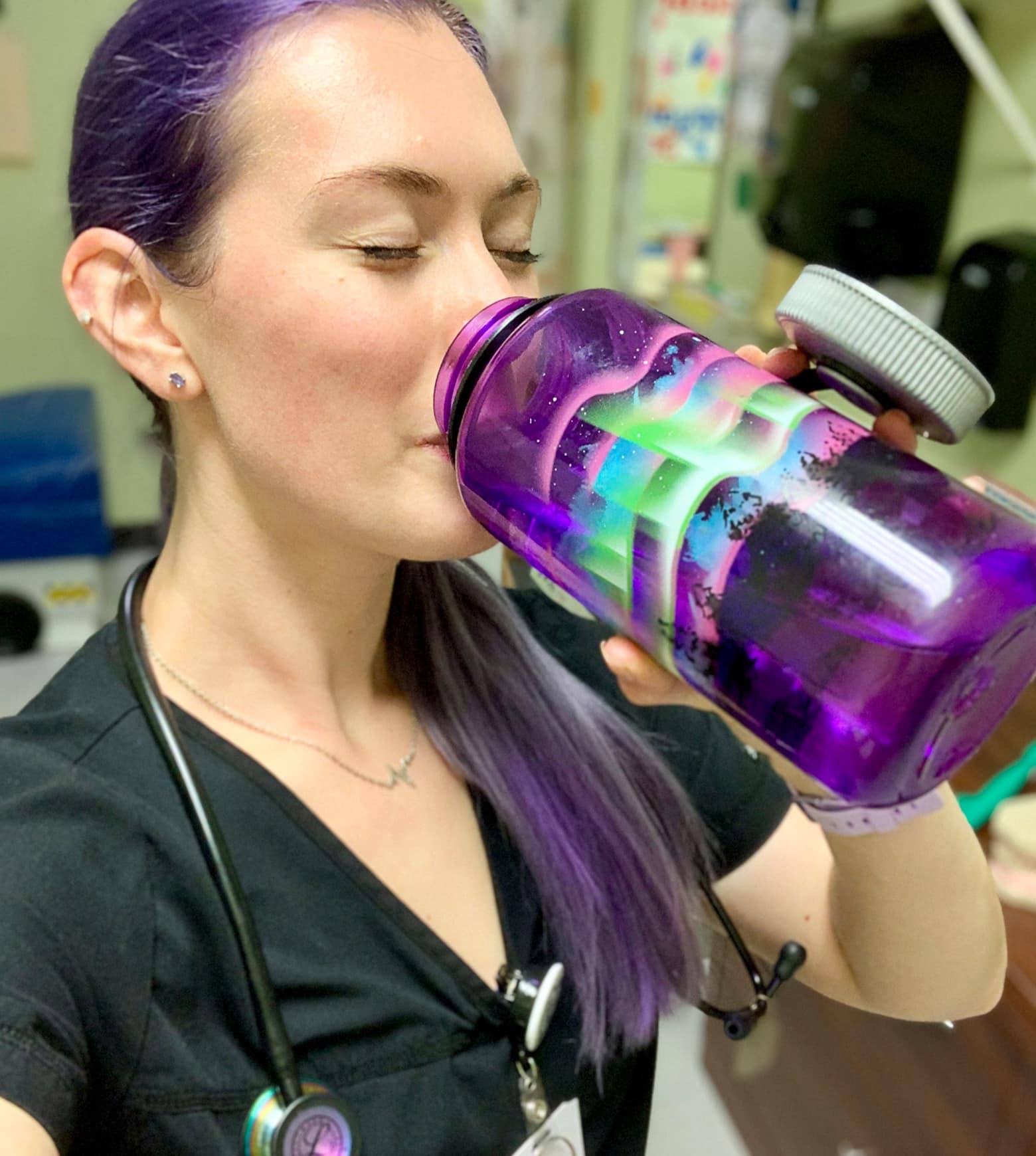 image from nalgene website of woman drinking from a water bottle