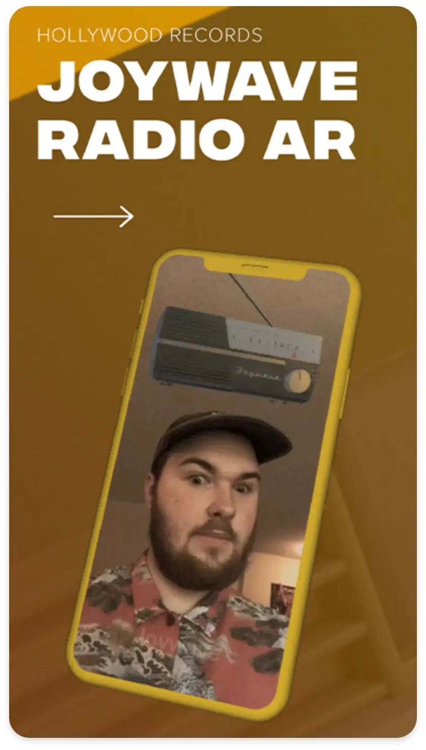 shot of a mobile view of osxr website showing a mobile phone with a man on it. text reads "hollywood records. joywave radio ar"