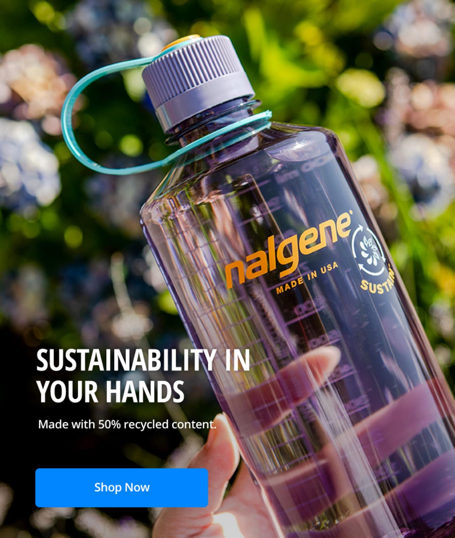 image of a nalgene water bottle with blurry background of nature "Sustainability in your hands. Made with 50% recycled content. Shop Now"