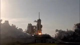 Gif of a NASA launch, craft leaving ground with flames sending it upwards 
