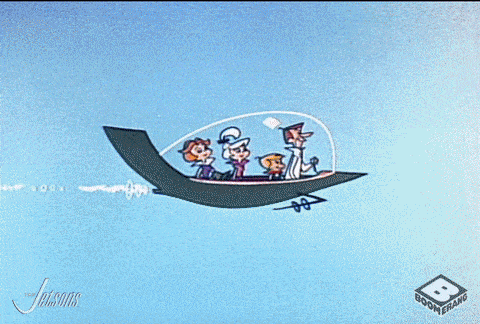 Gif of the cartoon Jetson family driving in a spaceship car.