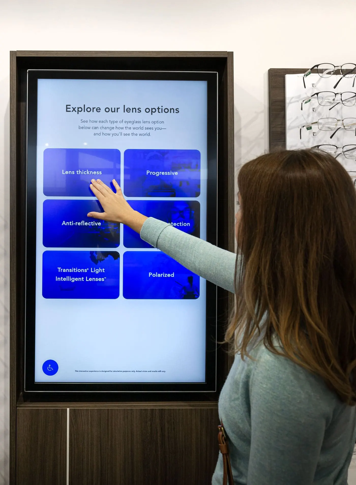 a woman interacting with a touchscreen