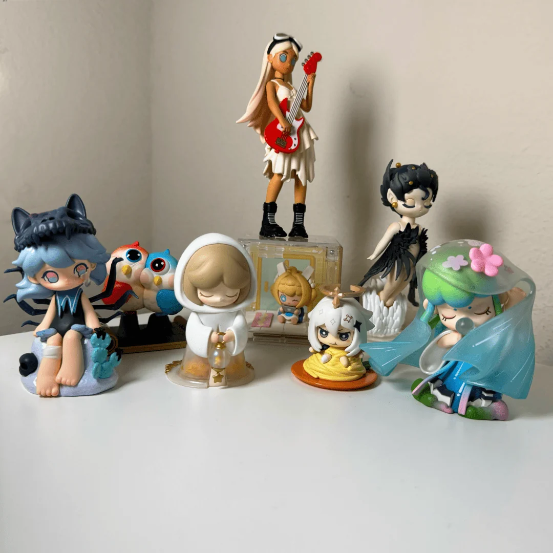 Blind Box plastic figurines sit atop Cindy's desk